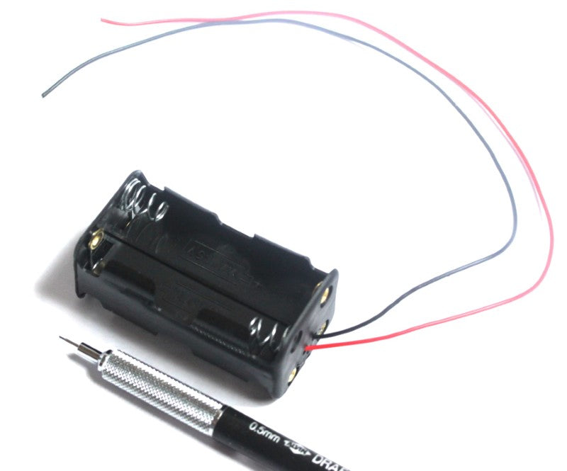 4 AA Battery Holder with Wire Leads shown with mechanical pencil for scale.