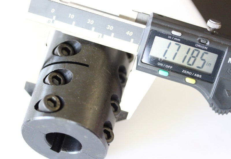 1/2 to 3/4 steel rigid coupling shown with a caliper. The measurement reads 1.7185 inches.