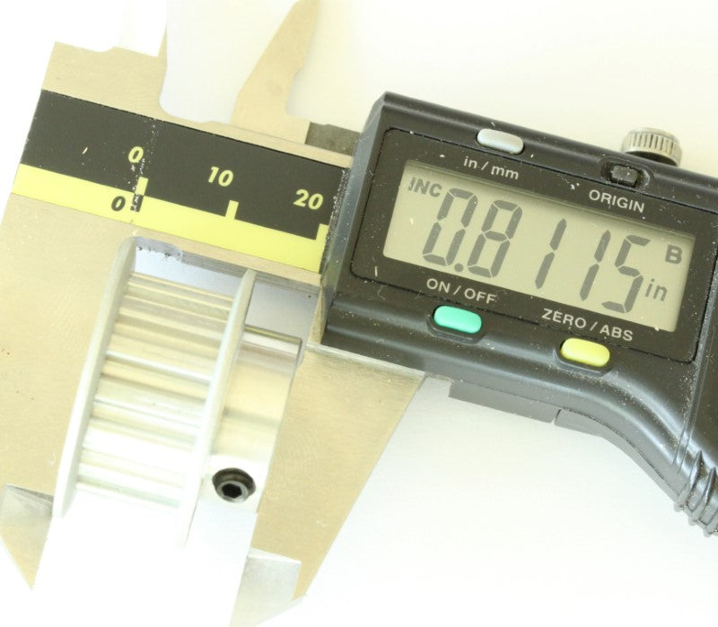 XL 15 teeth drive pulley 1/2" bore .2" pitch shown with a caliper. The measurement reads .8115 inches. 