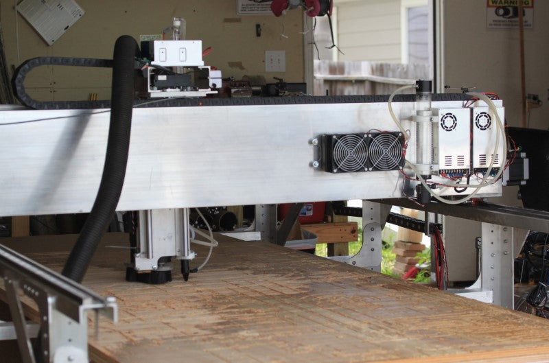 Fabricator Pro CNC Router view of the back of the gantry.  The cooling water pump and fan and radiator and the power supplies can be seen in this view.