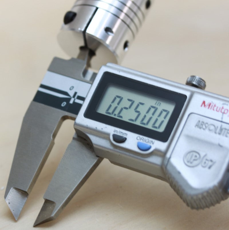 Caliper measurement of the 1/4" bore end of the 1/4" to 1/2" (12.7mm to 6.35mm) one piece flexible clamping coupling