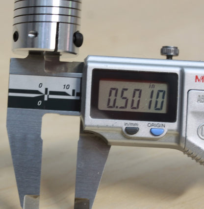 Caliper measurement of the 1/2" bore end of the 1/4" to 1/2" (12.7mm to 6.35mm) one piece flexible clamping coupling