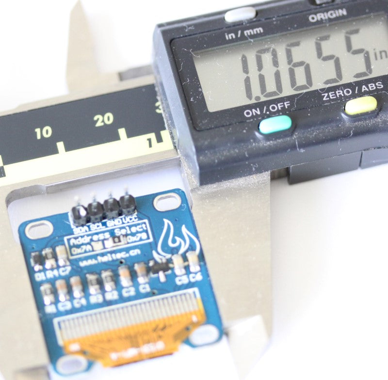 Width measurement of the 128x64 display module measuring 1.0655 inches (27.0637 mm)