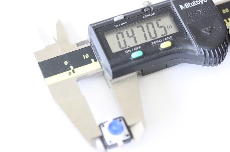 LED button shown with a caliper. The measurement reads .4705 inches. 