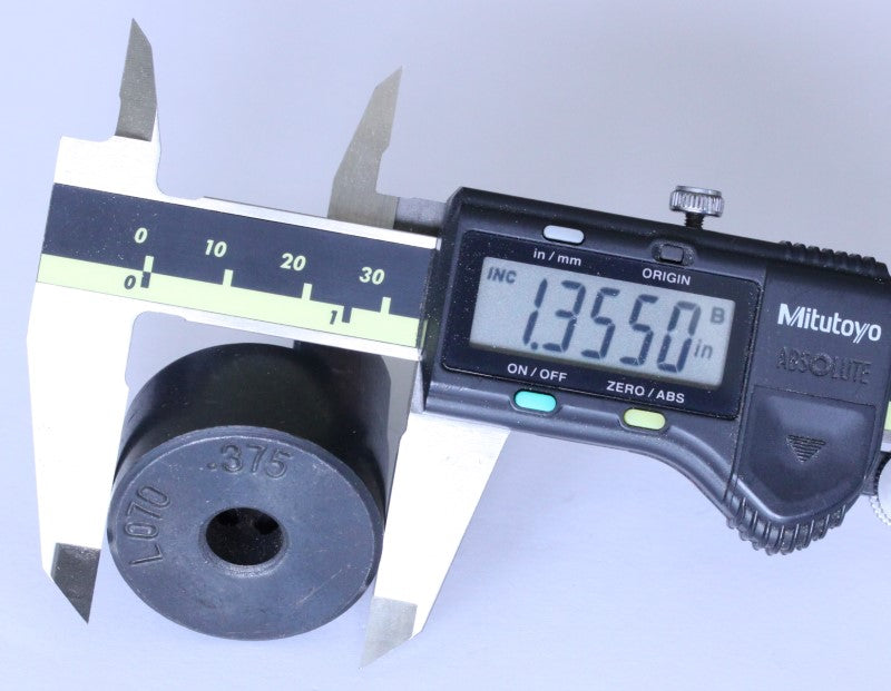 three eighths inch coupling hub shown with a caliper. The measurement reads 1.355 inches. 