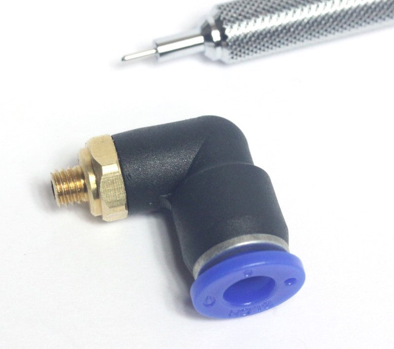 Nozzle Tube Fitting for Air Assist shown with mechanical pencil for scale. 