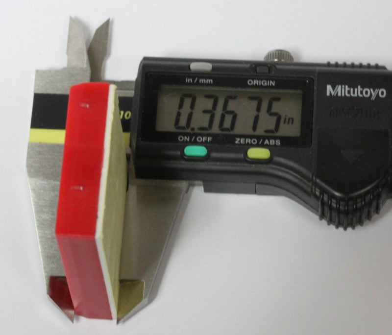 A mini breadboard in a caliper showing thickness. 