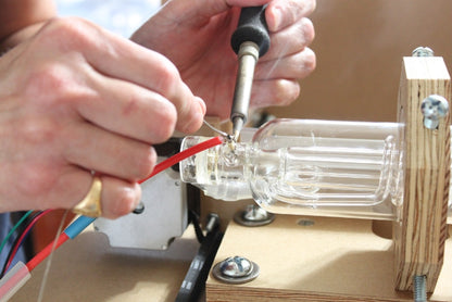 Solder the high tension line to the laser tube.